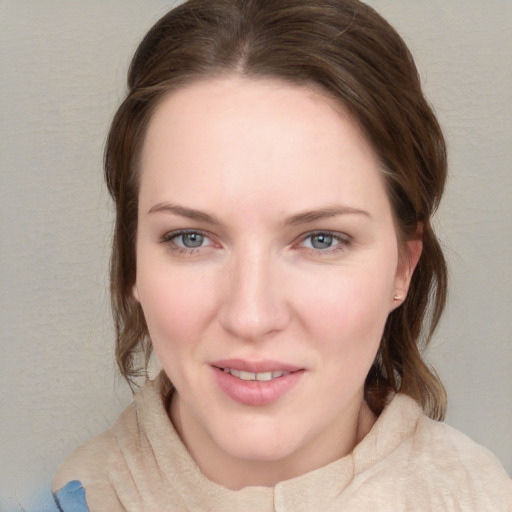 Joyful white young-adult female with medium  brown hair and blue eyes