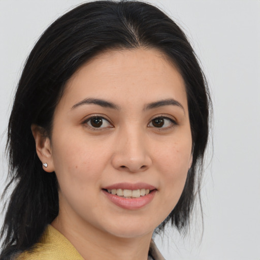 Joyful asian young-adult female with medium  brown hair and brown eyes