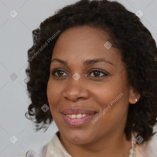 Joyful black young-adult female with medium  brown hair and brown eyes