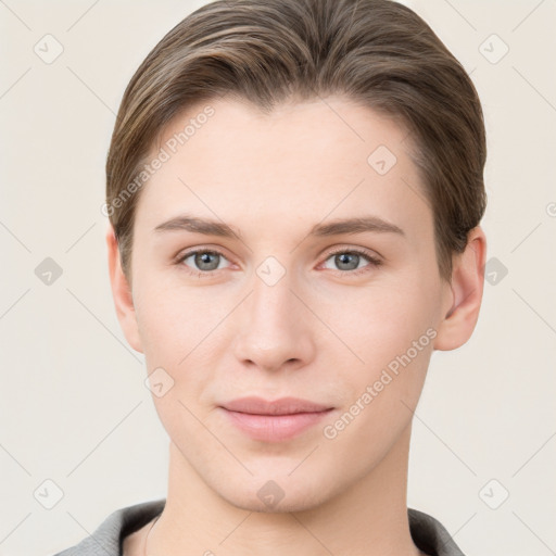 Joyful white young-adult female with short  brown hair and grey eyes