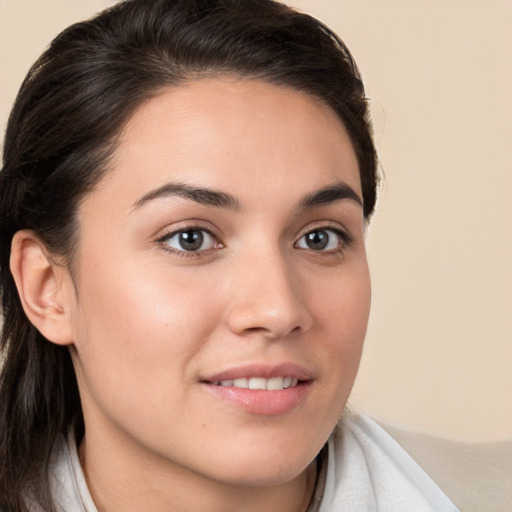 Joyful white young-adult female with medium  brown hair and brown eyes