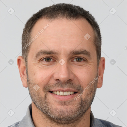 Joyful white adult male with short  brown hair and brown eyes