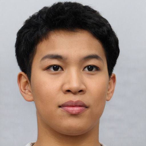 Joyful latino young-adult male with short  brown hair and brown eyes