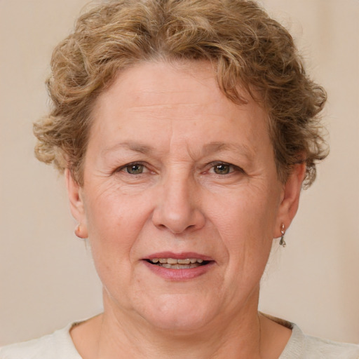 Joyful white middle-aged female with short  brown hair and brown eyes