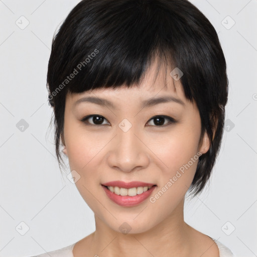 Joyful asian young-adult female with medium  black hair and brown eyes