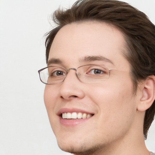 Joyful white young-adult male with medium  brown hair and brown eyes