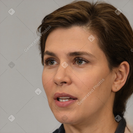 Joyful white adult female with medium  brown hair and brown eyes