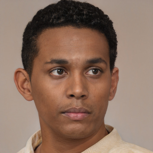 Neutral black young-adult male with short  black hair and brown eyes