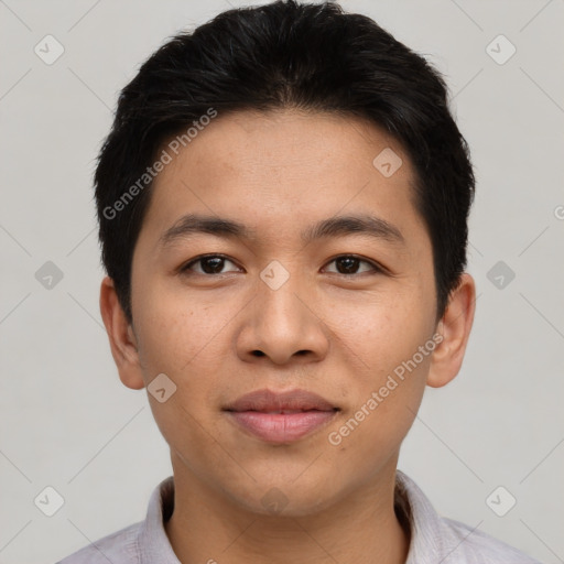 Joyful asian young-adult male with short  brown hair and brown eyes