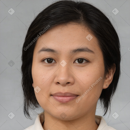 Joyful asian young-adult female with medium  brown hair and brown eyes