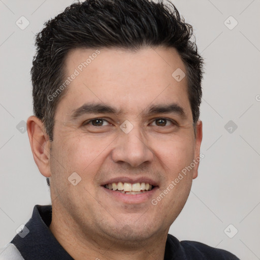 Joyful white young-adult male with short  black hair and brown eyes