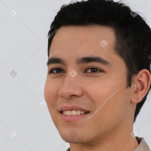 Joyful latino young-adult male with short  black hair and brown eyes