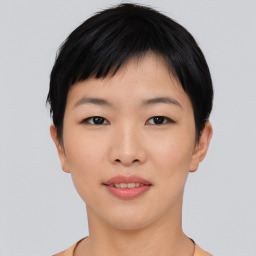 Joyful asian young-adult female with short  black hair and brown eyes