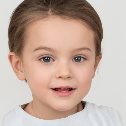 Joyful white child female with short  brown hair and brown eyes