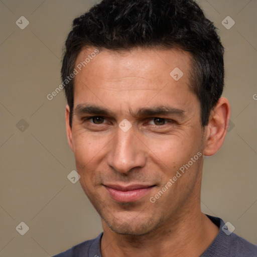 Joyful white adult male with short  black hair and brown eyes