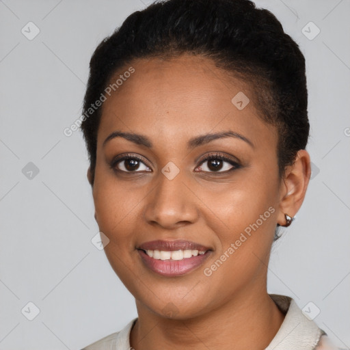 Joyful black young-adult female with short  black hair and brown eyes