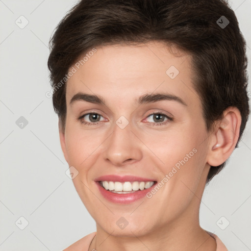 Joyful white young-adult female with short  brown hair and brown eyes