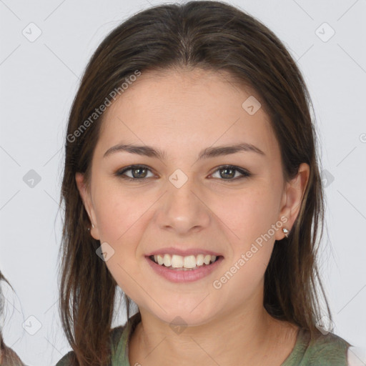 Joyful white young-adult female with long  brown hair and brown eyes