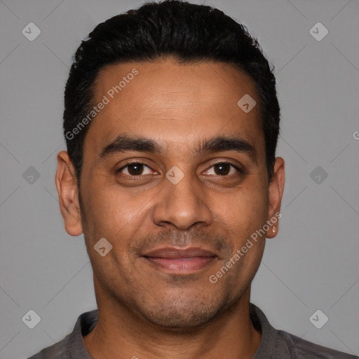 Joyful latino young-adult male with short  black hair and brown eyes