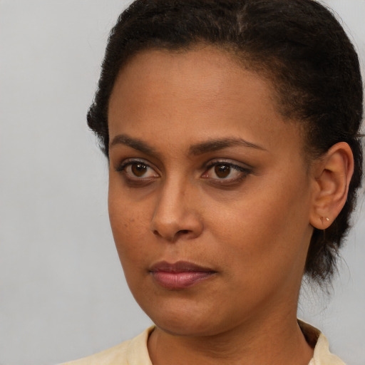 Neutral latino young-adult female with short  brown hair and brown eyes