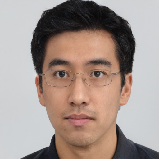 Neutral asian adult male with short  black hair and brown eyes