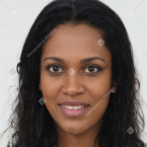 Joyful black young-adult female with long  brown hair and brown eyes