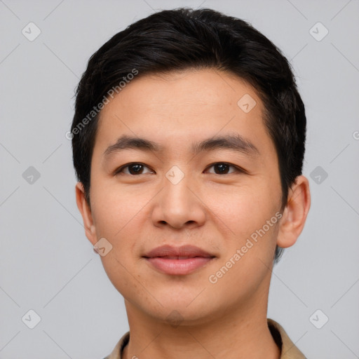 Joyful asian young-adult male with short  black hair and brown eyes