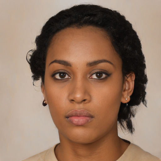 Neutral black young-adult female with short  black hair and brown eyes