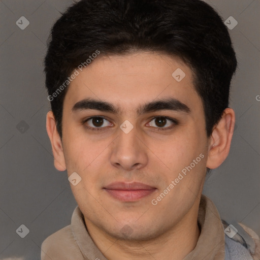 Joyful latino young-adult male with short  brown hair and brown eyes