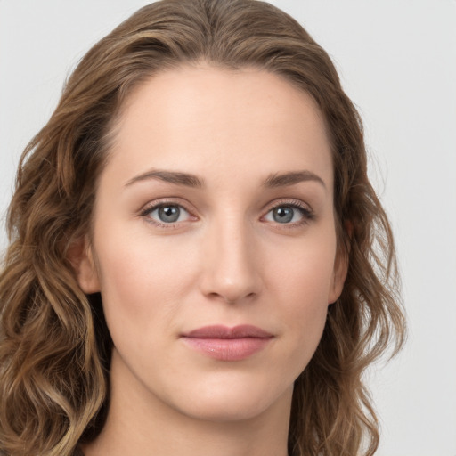 Joyful white young-adult female with long  brown hair and green eyes