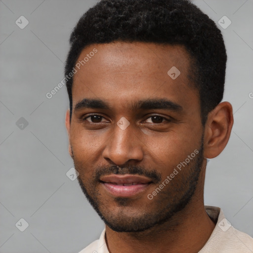 Joyful black young-adult male with short  black hair and brown eyes