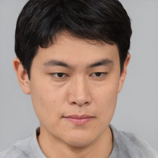 Neutral asian young-adult male with short  brown hair and brown eyes