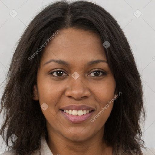 Joyful black young-adult female with long  brown hair and brown eyes