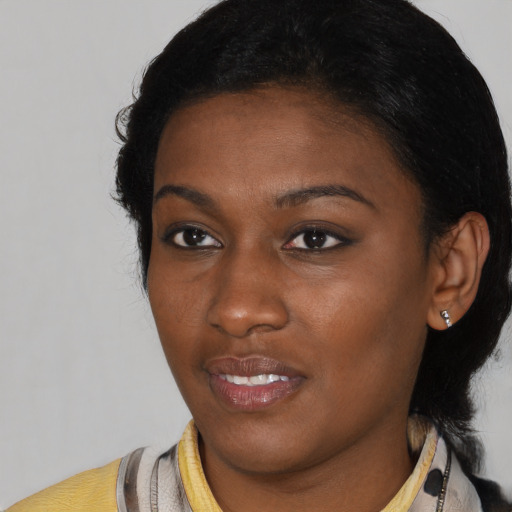 Joyful latino young-adult female with short  black hair and brown eyes
