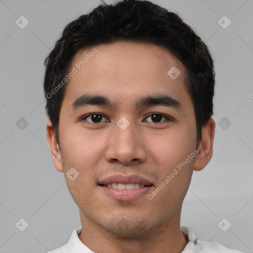 Joyful white young-adult male with short  black hair and brown eyes