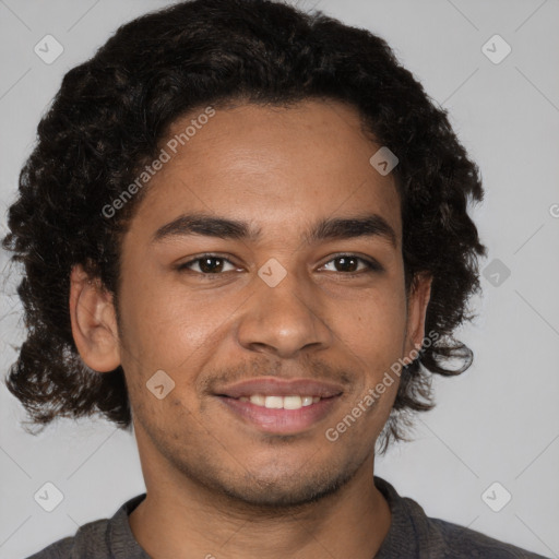 Joyful black young-adult male with short  brown hair and brown eyes