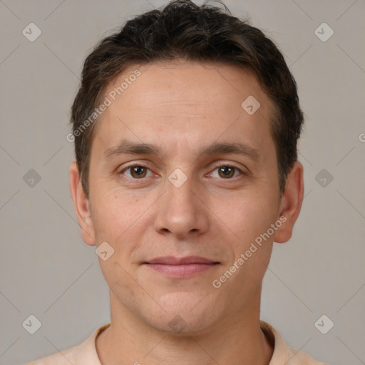 Joyful white young-adult male with short  brown hair and brown eyes