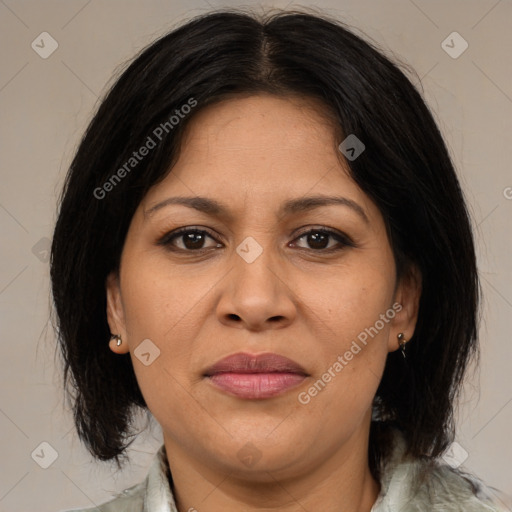 Joyful latino adult female with medium  brown hair and brown eyes