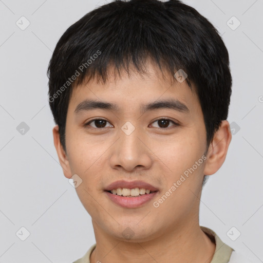 Joyful asian young-adult male with short  black hair and brown eyes