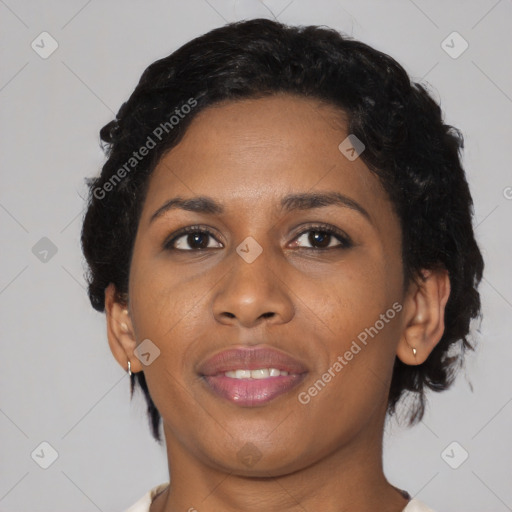 Joyful black adult female with medium  brown hair and brown eyes