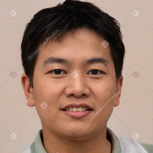 Joyful asian young-adult male with short  brown hair and brown eyes