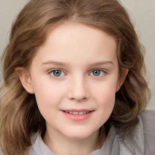 Joyful white child female with medium  brown hair and blue eyes