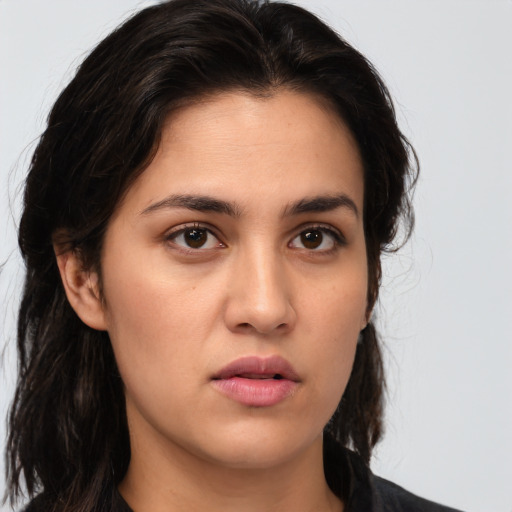 Neutral white young-adult female with long  brown hair and brown eyes