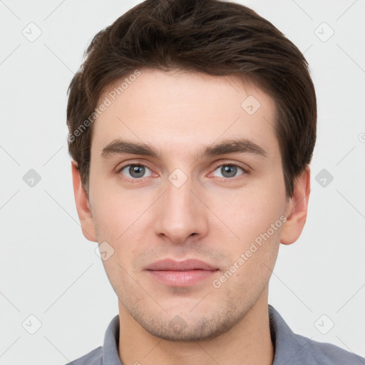 Neutral white young-adult male with short  brown hair and grey eyes