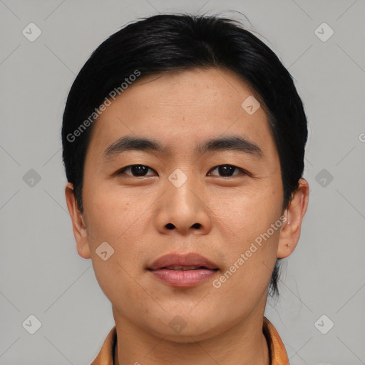 Joyful asian young-adult male with short  black hair and brown eyes