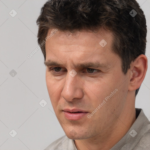 Neutral white adult male with short  brown hair and brown eyes