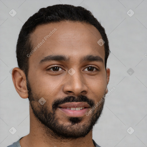 Joyful black young-adult male with short  black hair and brown eyes