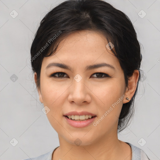 Joyful asian young-adult female with medium  black hair and brown eyes