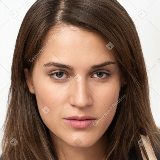 Neutral white young-adult female with long  brown hair and brown eyes