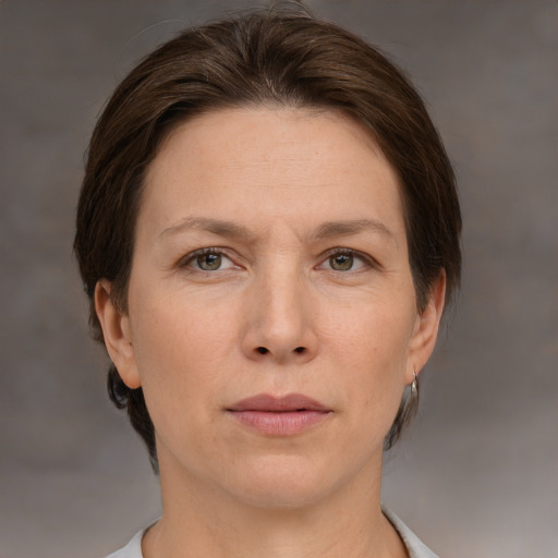 Neutral white adult female with short  brown hair and grey eyes